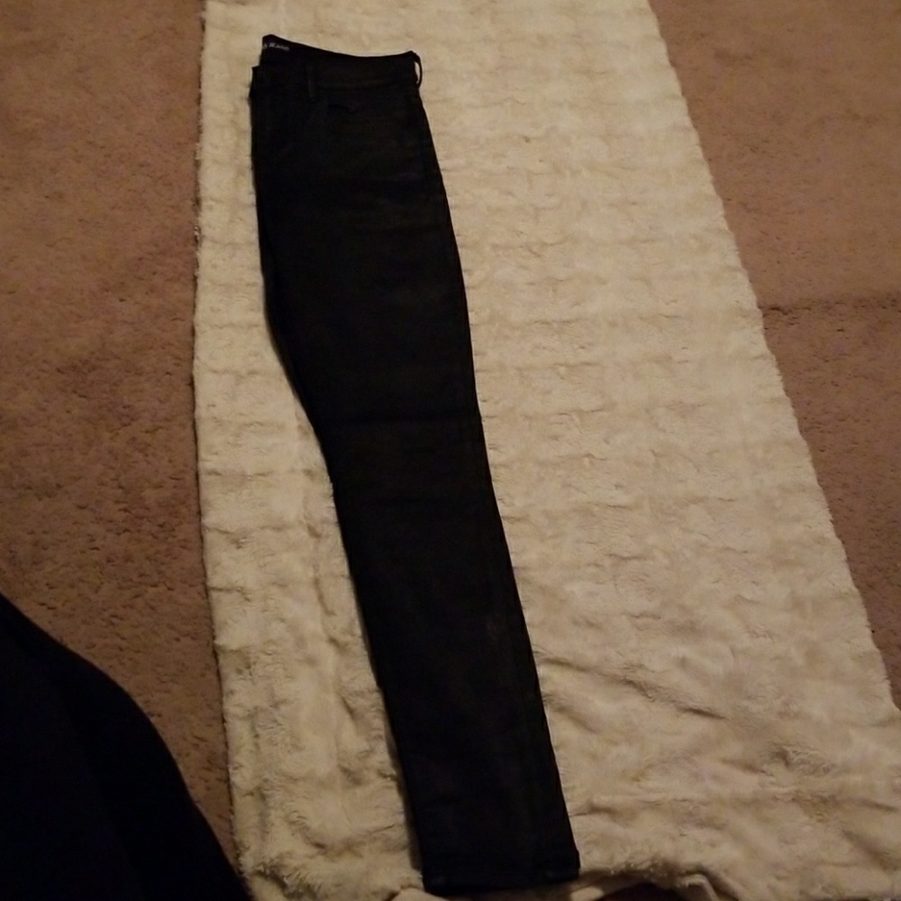 Black coated skinny jeans.