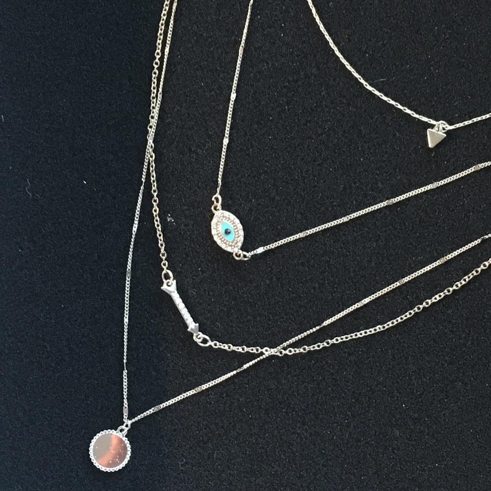 multiple chained necklace with decorative pendants