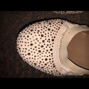 Cute flat nude shoes .