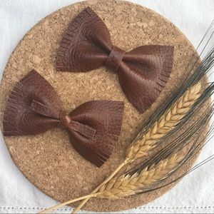 Handmade leather fringe bows