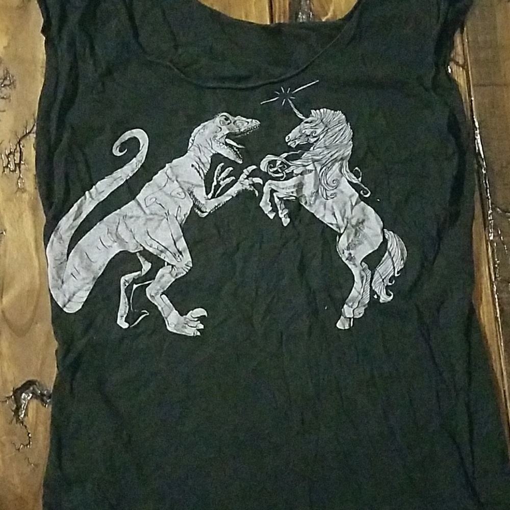 Unicorn versus dinosaur shirt medium