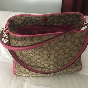 Coach pink and tan handbag.