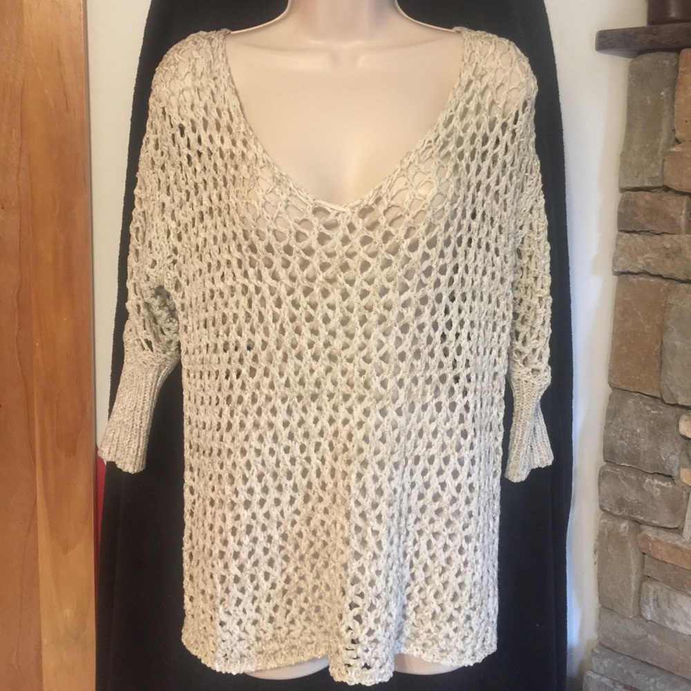 Gold and off white sweater.