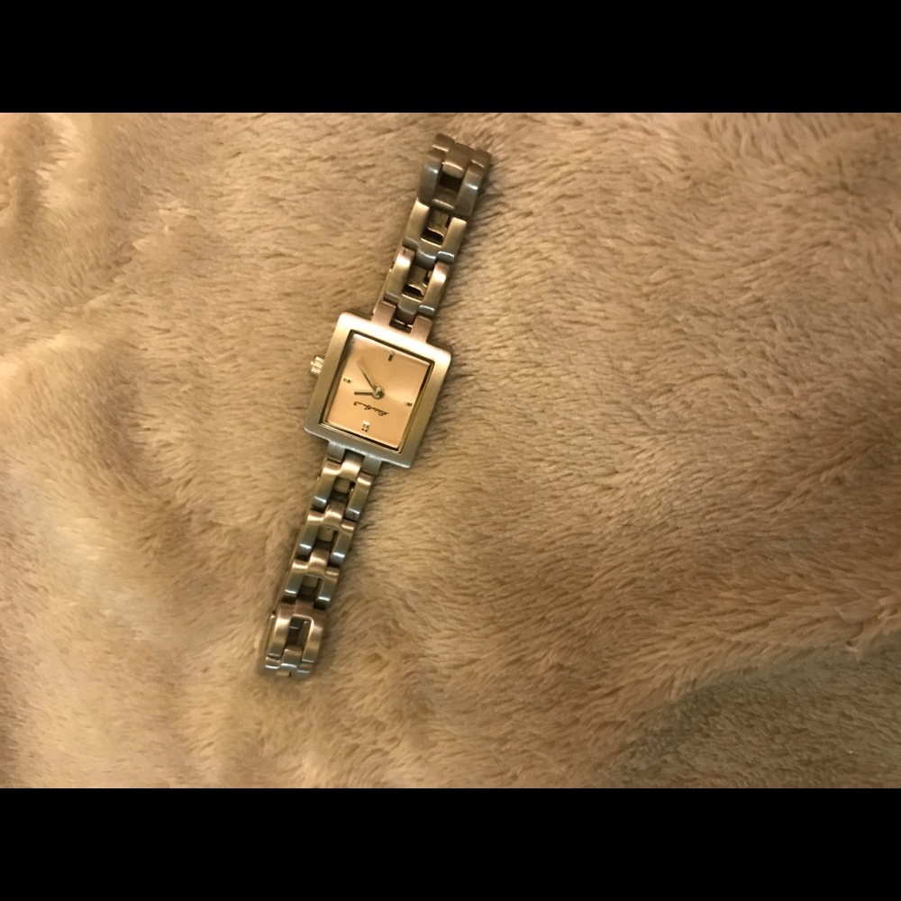 Eddie Bauer small silver watch with pink tint.