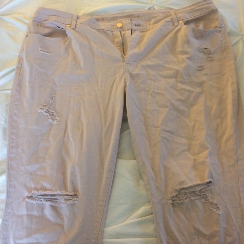 Jennifer Lopez pink distressed skinny ankle jeans
