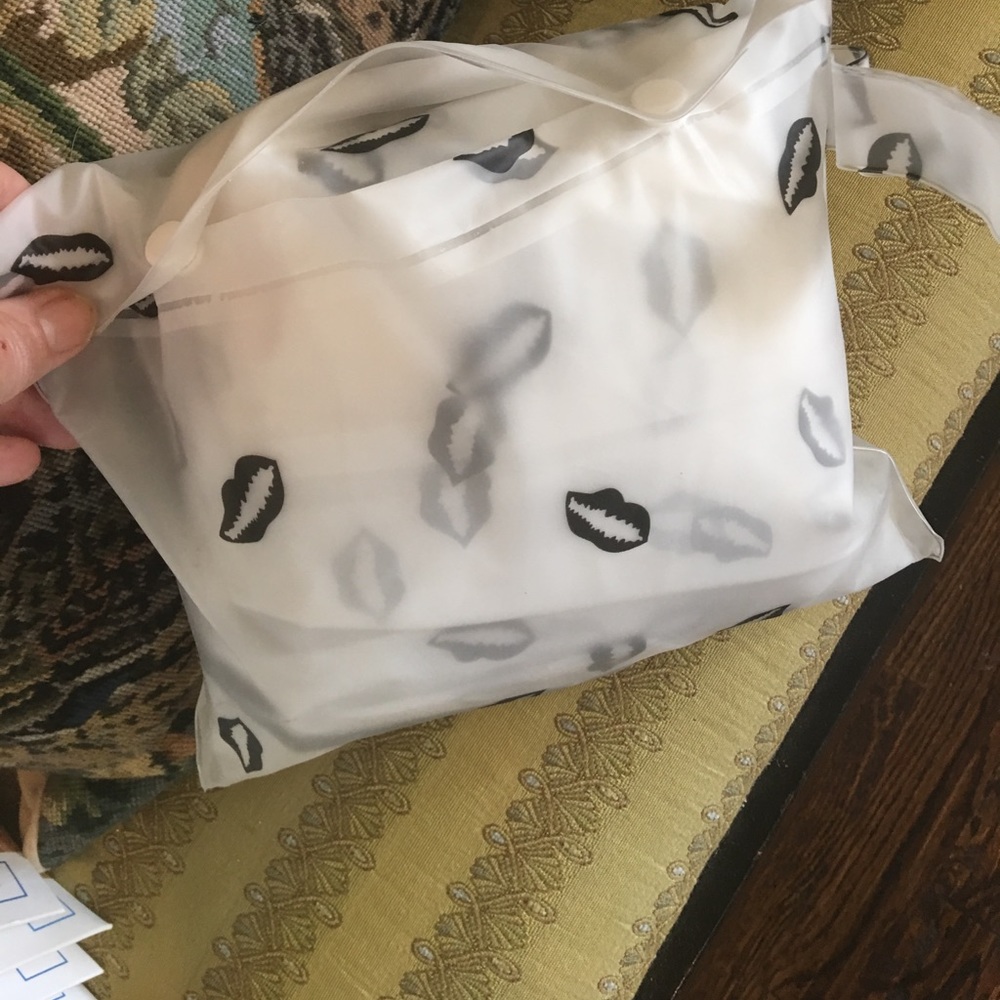 Rain Poncho with lip prints in pouch