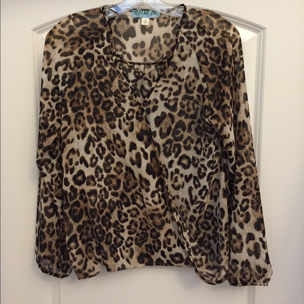 NWOT 100% Polyester sheer top with crisscross trim