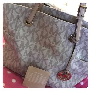 Beige and white Michael Kors purse