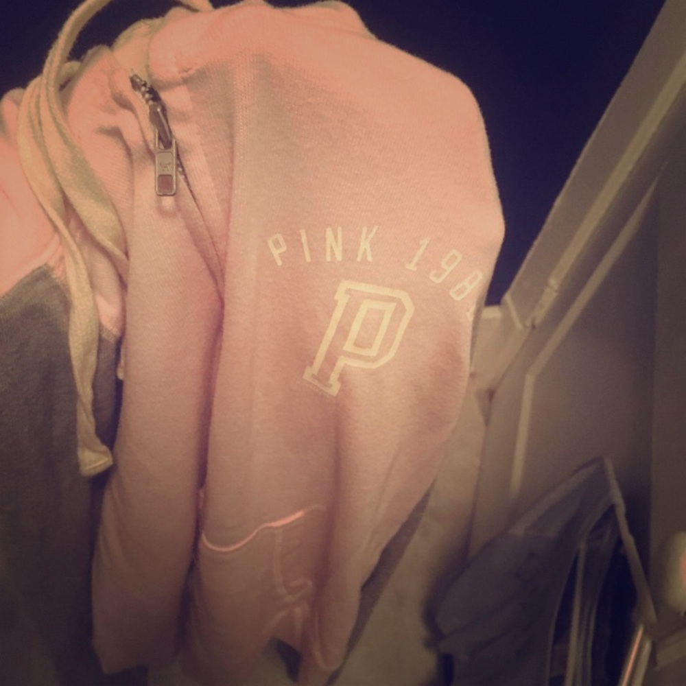 Pink zip up hoodie.