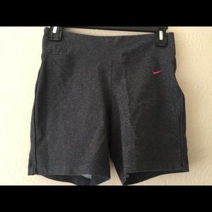 Dark grey Nike dri fit shorts.