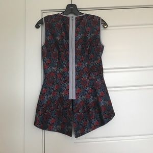 Gorgeous peplum top with fun pattern and detail.