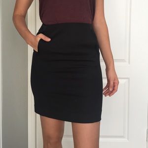 bebe black mini skirt with pockets. Size 4.
