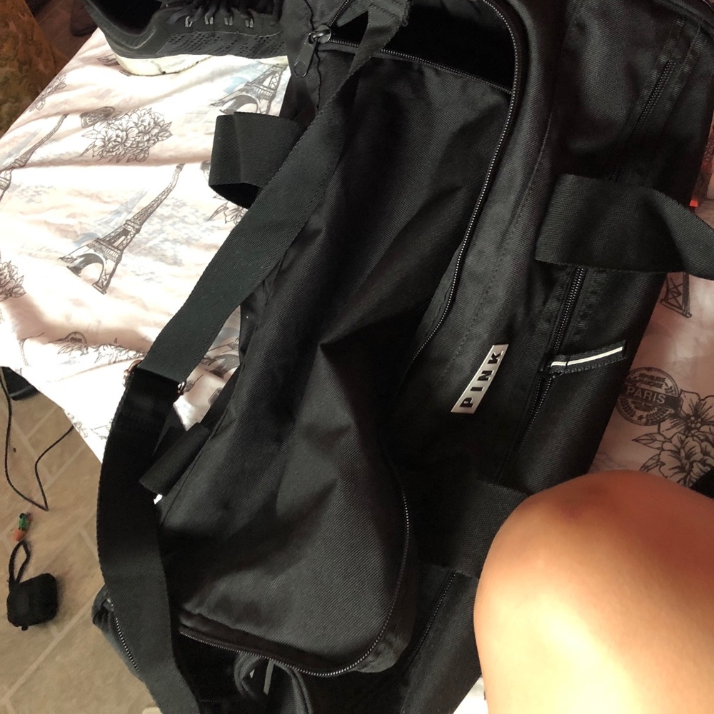Pink duffle bag.