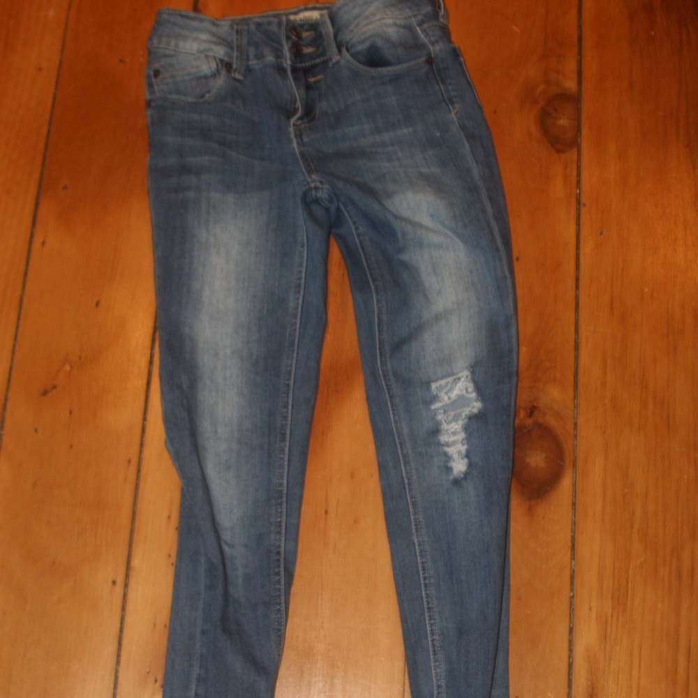 Dark washed ripped jeans.