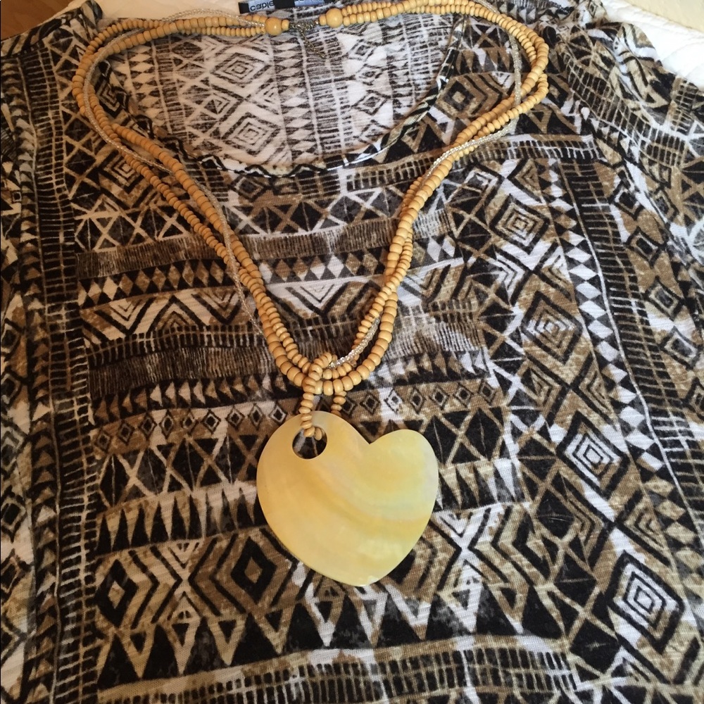 Shell heart necklace with wood and clear Beads.