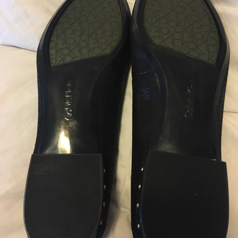 Calvin Klein flat black shoes.