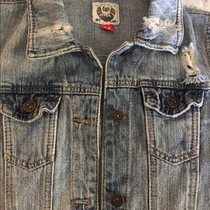 Distressed denim jacket