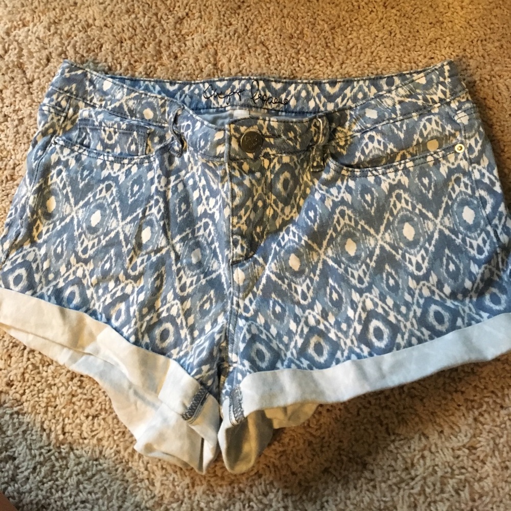Patterned denim shorts.