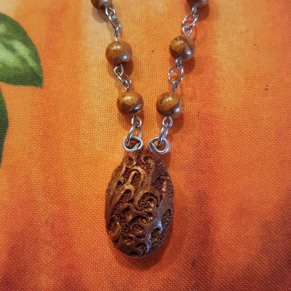 Beautiful carved clay necklace