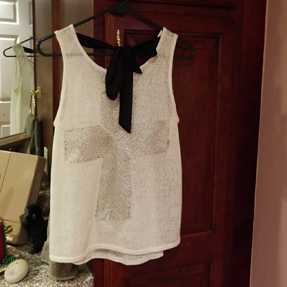 White tank with silver cross and black tie