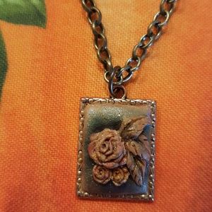 Beautiful hand carved clay Rose pendant