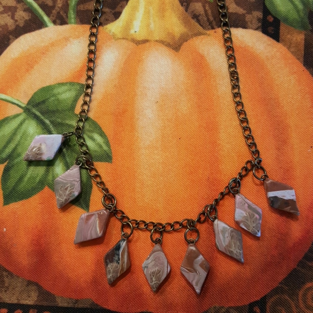 Hand carved clay necklace