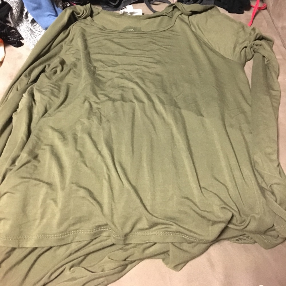 Green shirt with embroidery on the back