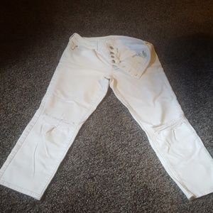 Distressed white jeans