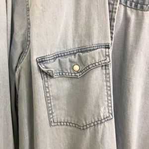 Chambray blue long sleeve button up shirt.