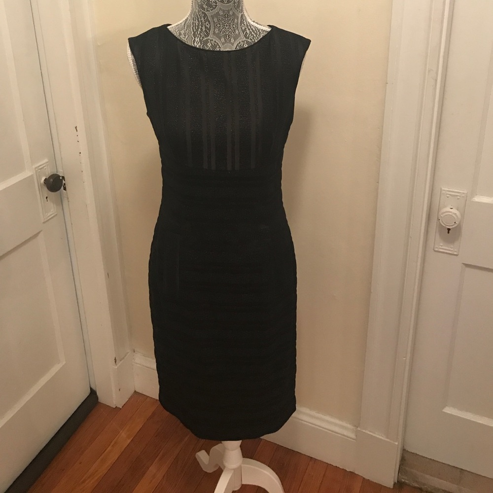 Black Anne Klein shimmer dress with pockets.