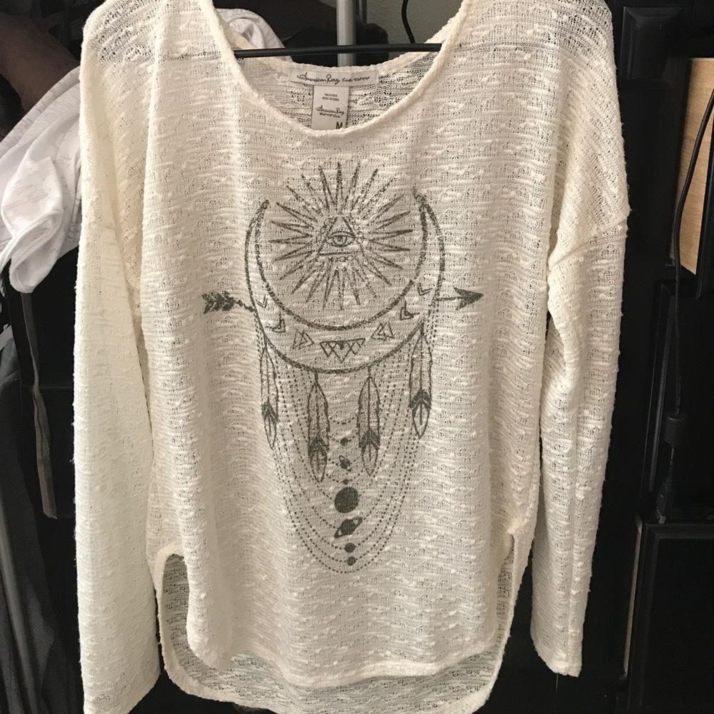 Cream long sleeve shirt with design