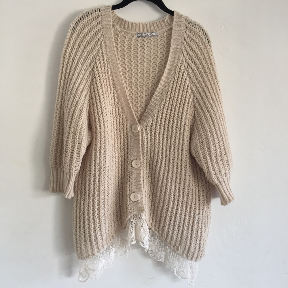 Knit cream sweater with 3/4 length sleeve