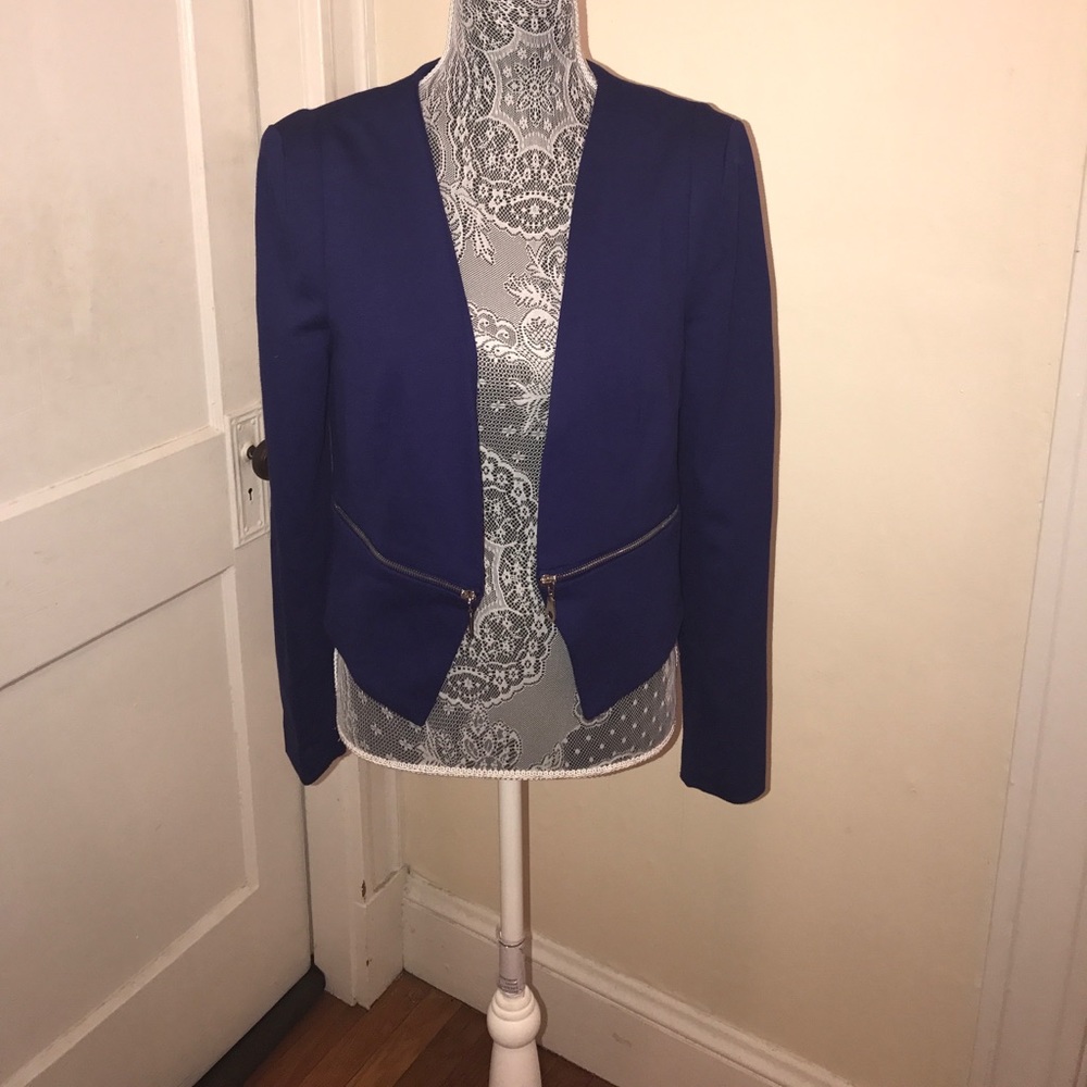 Blue blazer with zippers. Never worn.