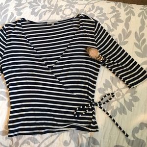 Blue and white striped top with a deep V and a bow