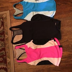 2 Lululemon workout tops. 1 black workout top