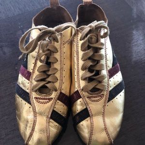 Gold tennis shoes