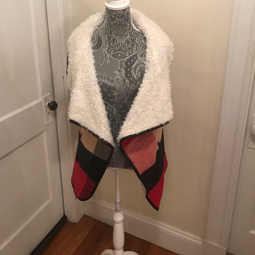 Great stylish multi colored vest. Never worn.