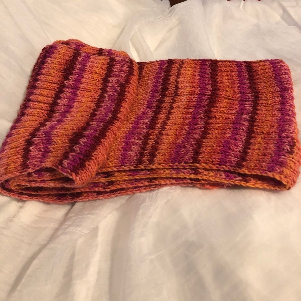 Hand knitted scarf.
