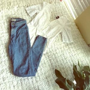 High waisted denim jeans and white leotard