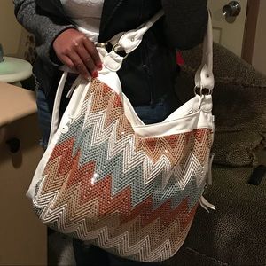 White purse with designs on front