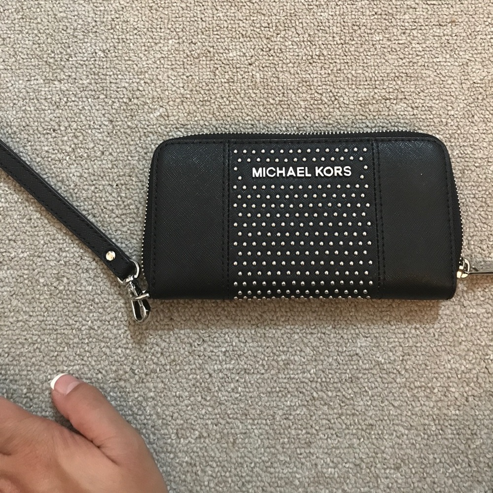 Michael Kors studded wristlet.