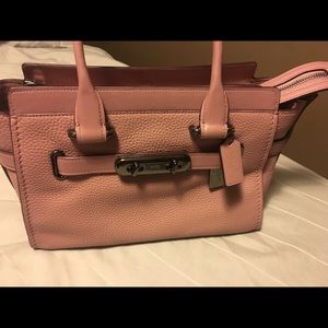 Brand new.  Authentic Coach purse.