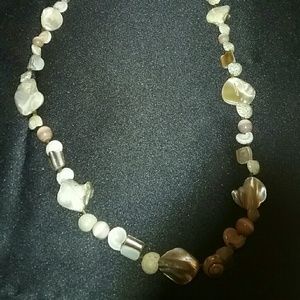 Beige sea shell necklace.
