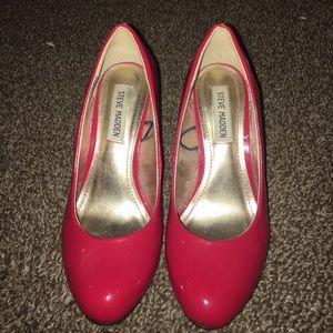 Red patent leather pumps