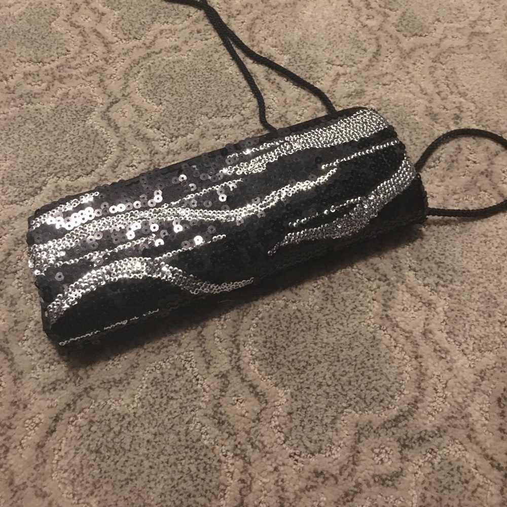 Black and silver sequin clutch