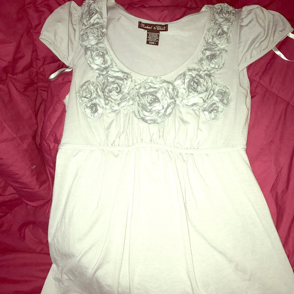 Short sleeve, flower embellished empire style top.