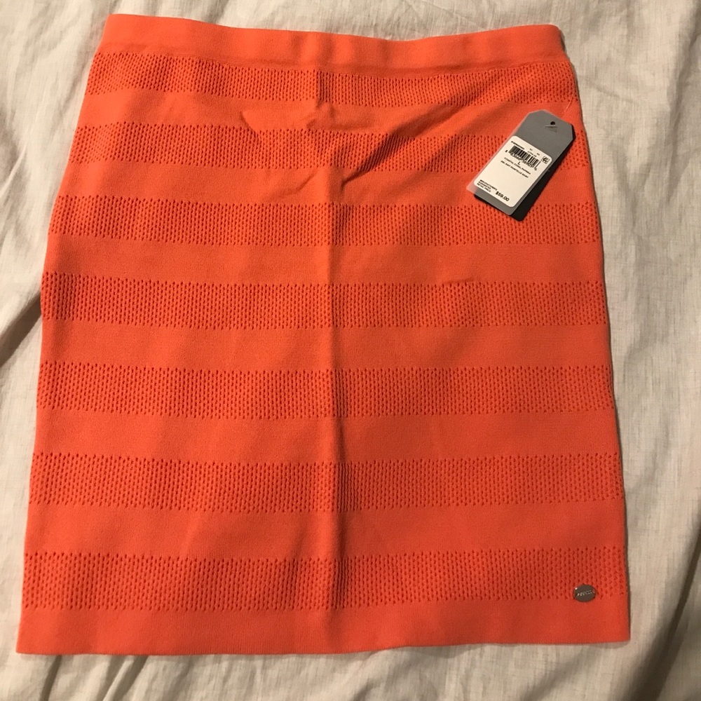 Coral peach colored fitted mini skirt by Guess