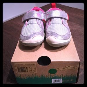 Plae pink and silver toddler shoes.