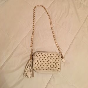 White purse with gold accents