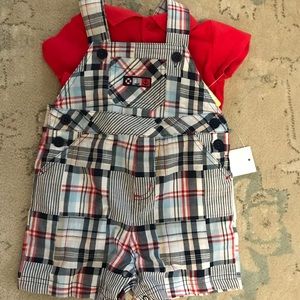 Plaid overalls and red shirt